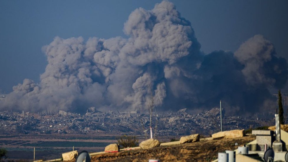 Smoke rising from buildings in Gaza after being hit by Israeli strikes on 1 December