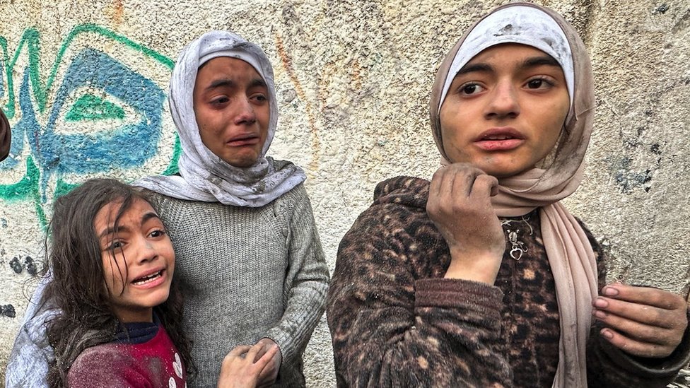Children react following an Israeli air strike on Palestinian houses, amid the ongoing conflict between Israel and the Palestinian Islamist group Hamas, in Rafah in the southern Gaza Strip December 12, 2023.