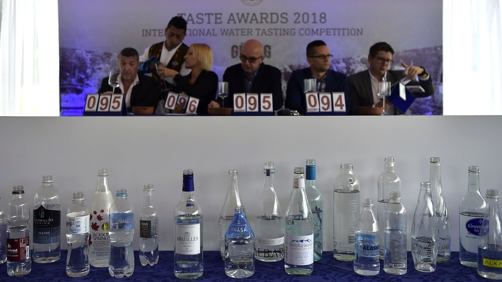 Water sommeliers and experts Horacio Bustos from Argentina, Rita Palandrani from Italy, Michael Mascha from the United States, Martin Riese from Germany and Juan Carlos Ordonez from Ecuador - members of the judge panel - tast water during the 2018 Fine Waters International Water Tasting Competition, in Machachi, Ecuador, on May 22, 2018.