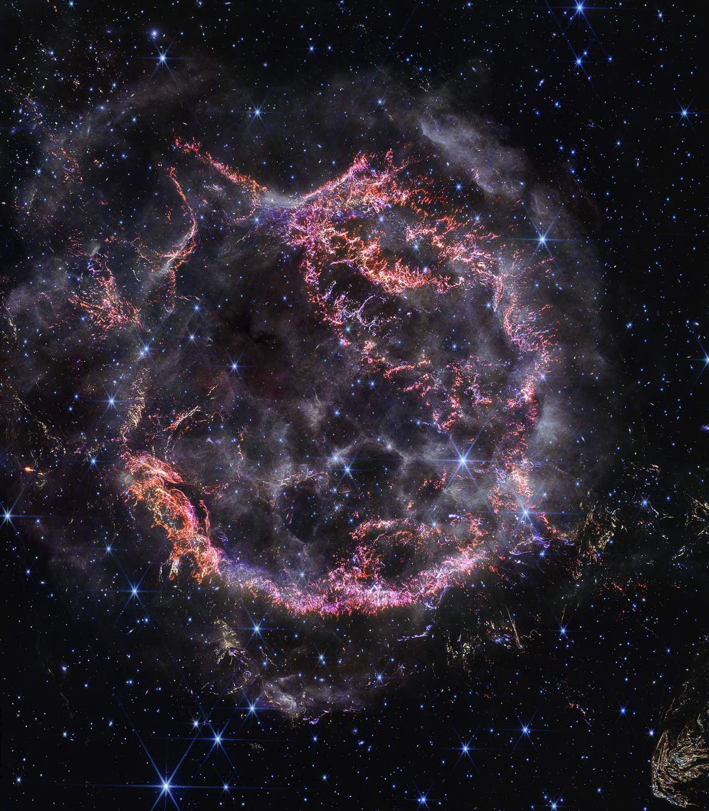 A bright ring, light-years across, known as CASSIOPEIA A