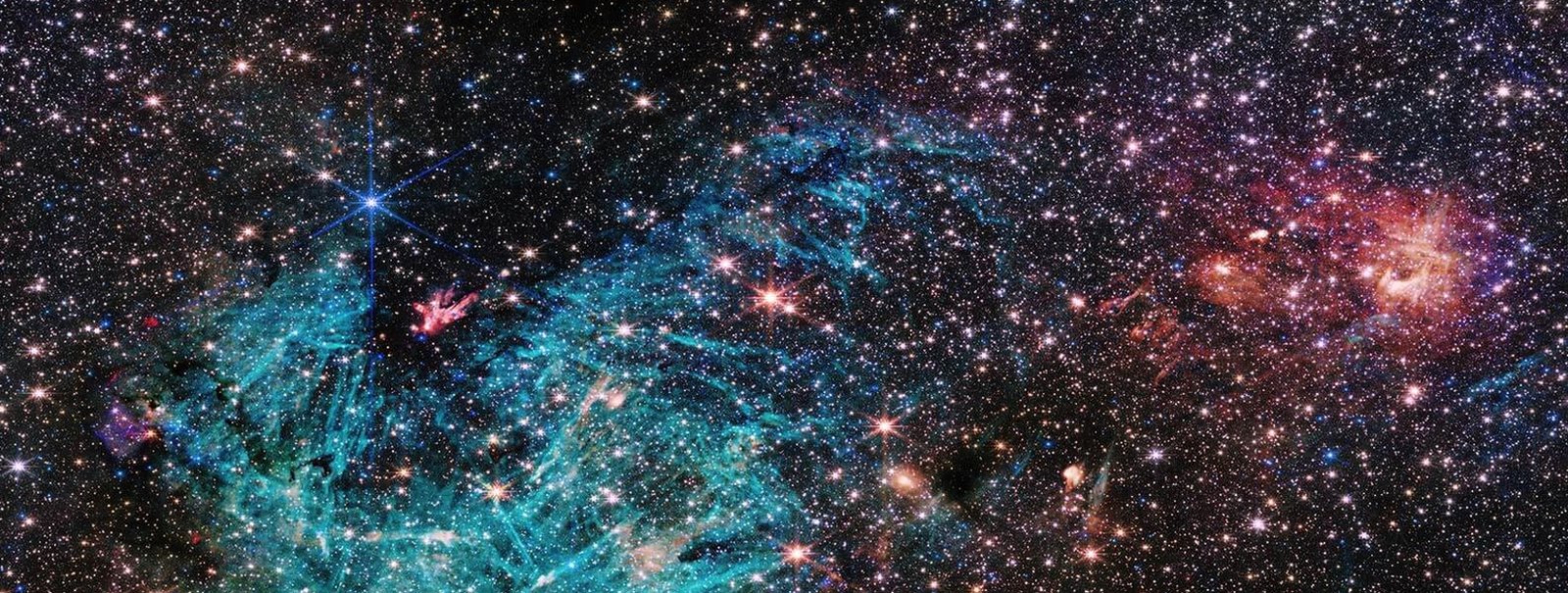 A ingle image shows half a million stars with bright cyan-coloured patches of excited hydrogen gas
