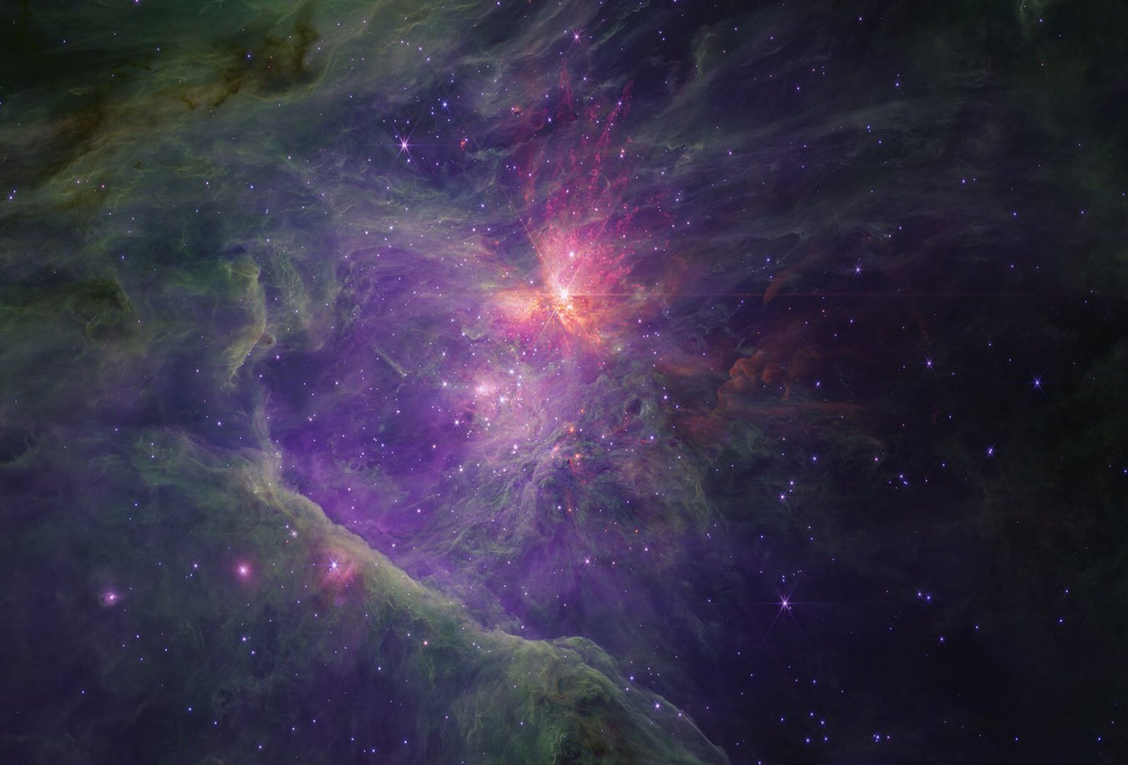 Bright orange light surrounds the Orion nebula, which can be seen as a smudge with the naked eye