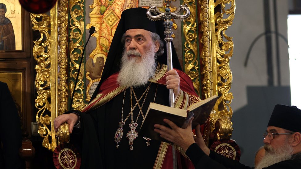 Greek Orthodox Patriarch of Jerusalem Theophilos III dressed in robes and holding a staff