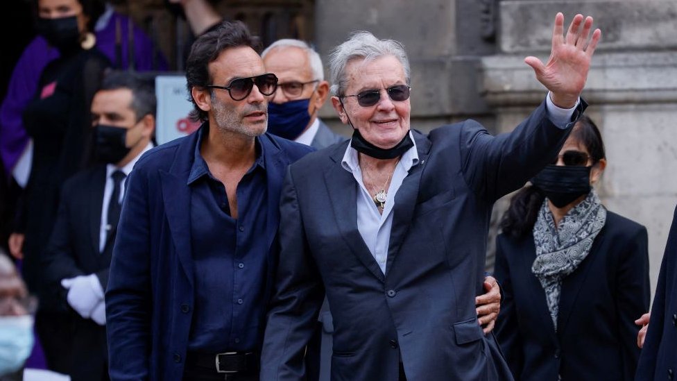 Alain Delon (R) his son Anthony Delon arrives for the funeral ceremony for late French actor Jean-Paul Belmondo at the Saint-Germain-des-Pres church in Paris on September 10, 2021