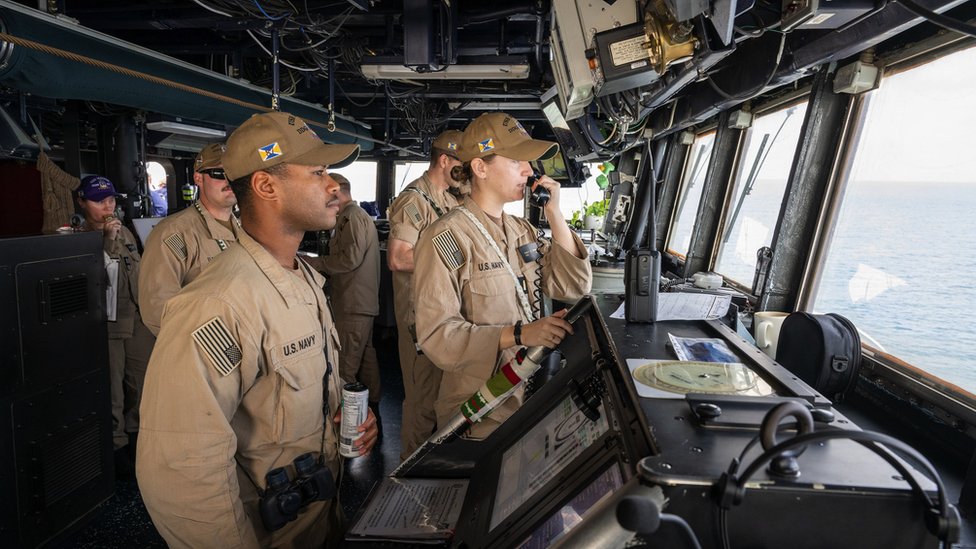 US Navy personnel in the pilot house of the USS Mason while the ship operates in support of Operation Prosperity Guardian in the Gulf of Aden on 26 December 2023