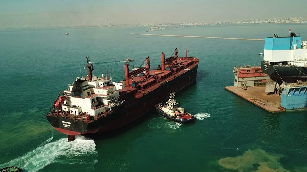 A handout photo made available by the Suez Canal Authority shows the Greek-owned bulk carrier Zografia (L) at the Suez Shipyard Co in Ismailia, Egypt, 22 January 2024