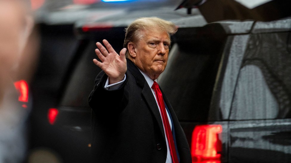 Former U.S. President Donald Trump gestures to his supporters, as he departs for his second civil trial after E. Jean Carroll accused Trump of raping her decades ago, outside a Trump Tower in the Manhattan borough of New York City, U.S., January 26, 2024