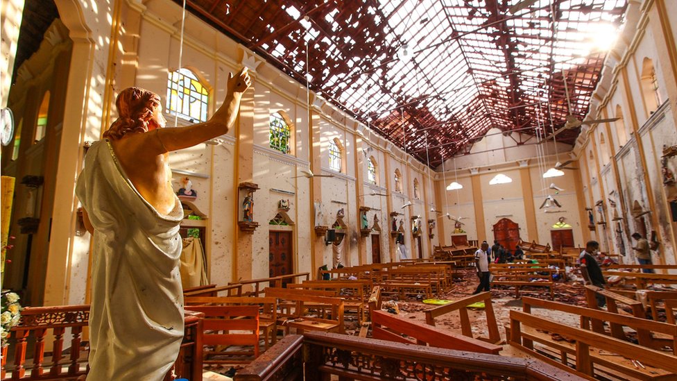 A statue of Jesus with his arm raised amid debris at St Sebastian's Church in Negombo, Sri Lanka following the Easter Sunday Bombing