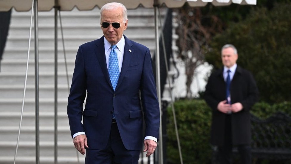 US President Joe Biden walks to talk to reporters before boarding Marine One on the South Lawn of the White House in Washington, DC, on 30 January, 2024