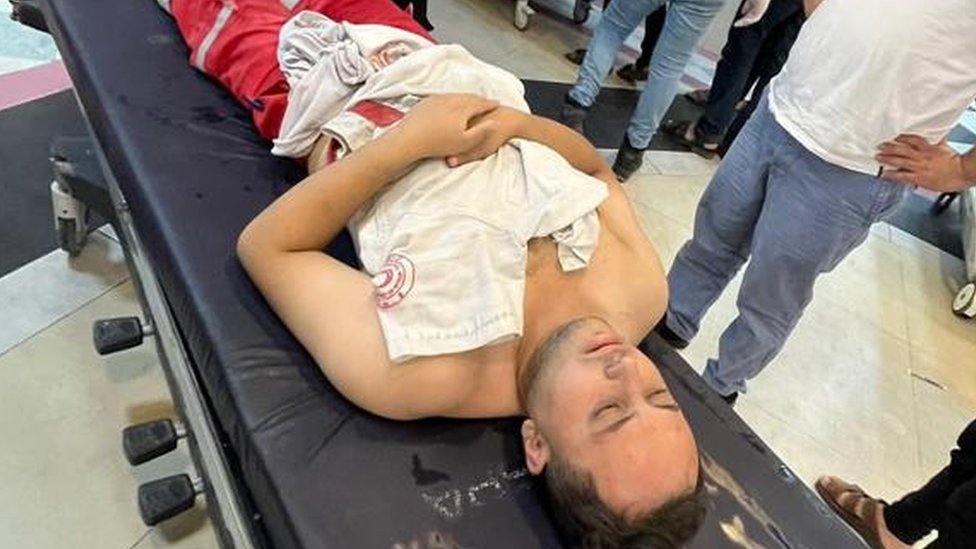 Mahmoud Al-Masry, lying injured on hospital trolley, 9 October 2023
