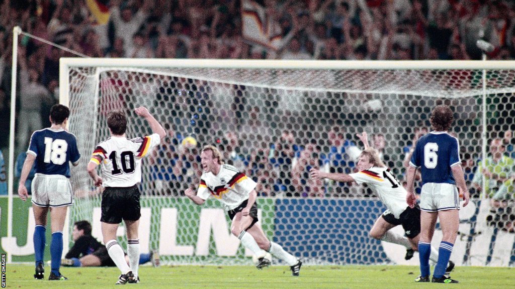 Former Germany defender Andreas Brehme celebrates scoring against Argentina in the 1990 World Cup final