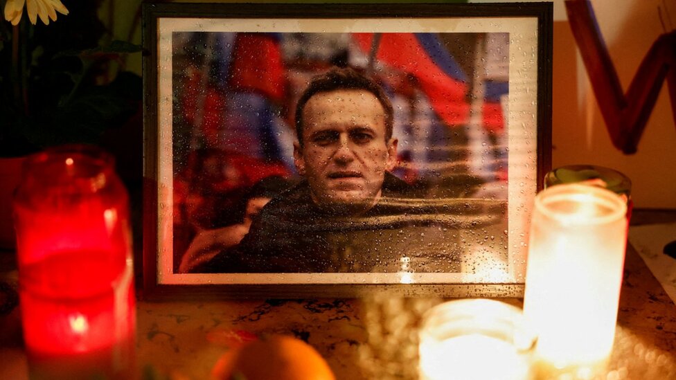 Candles burn as people attend a vigil following the death of Russian opposition leader Alexei Navalny