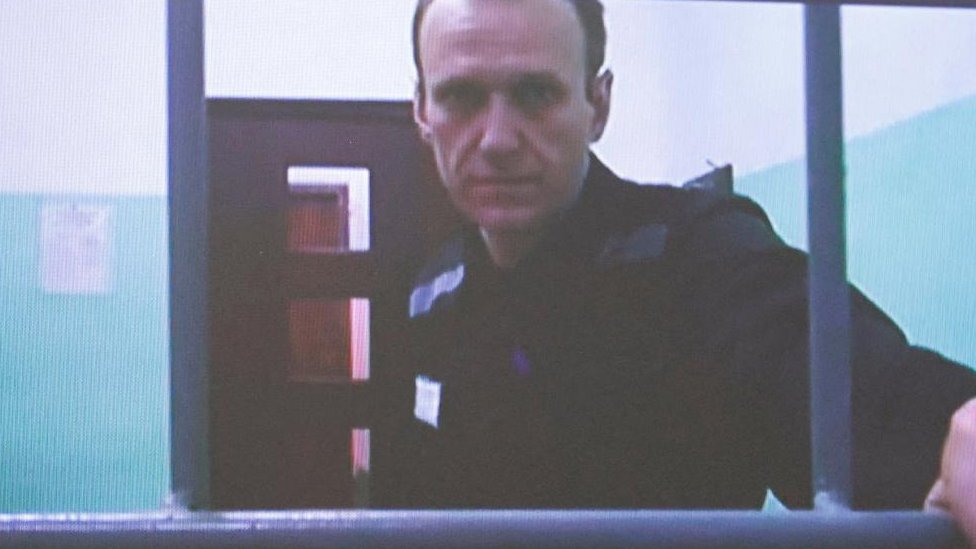 Alexei Navalny appears on a screen via video link from the IK-6 penal colony in the Vladimir region, during a court hearing to consider an appeal against his sentence in the criminal case on numerous charges, including the creation of an extremist organization, in Moscow, Russia September 26, 2023