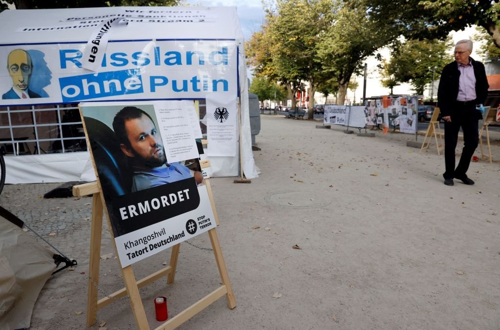 A poster bearing a portrait of Georgian national Zelimahn Khangoshvili, who was shot dead by an alleged Russian operative in Berlin's Kleiner Tiergarten Park in August 2019