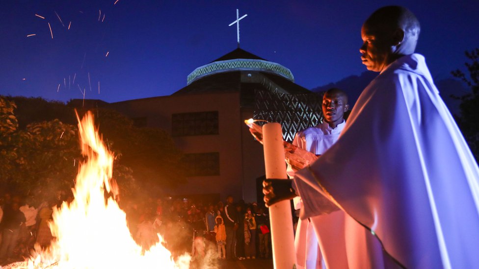 Priests led the service in Nairobi next to a fire outside the church