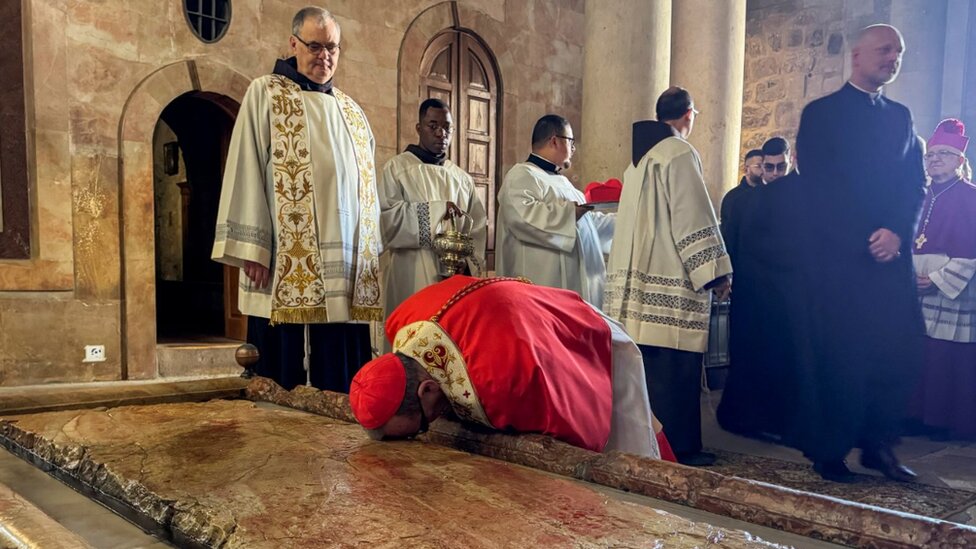 Archbishop Pierbattista Pizzaballa, leads Easter Sunday Mass in the Church of the Holy Sepulchre in Jerusalem's Old City