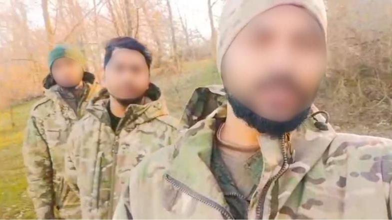 Men in army uniforms, their faces are blurred