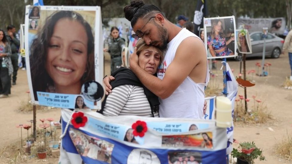 Family members of victims visit the memorial site for the music festival in southern Israel attacked by Hamas