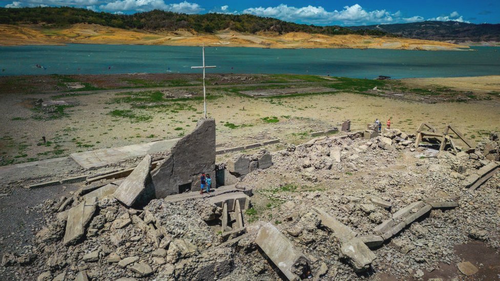 An aerial view of the old sunken town of Pantabangan on April 28, 2024 in Nueva Ecija province, Philippines. Due to a severe drought in the Philippines, a centuries-old settlement submerged since the 1970s has reemerged, attracting tourists despite the extreme heat.