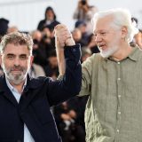 Eugene Jarecki (L) and Julian Assange (R)