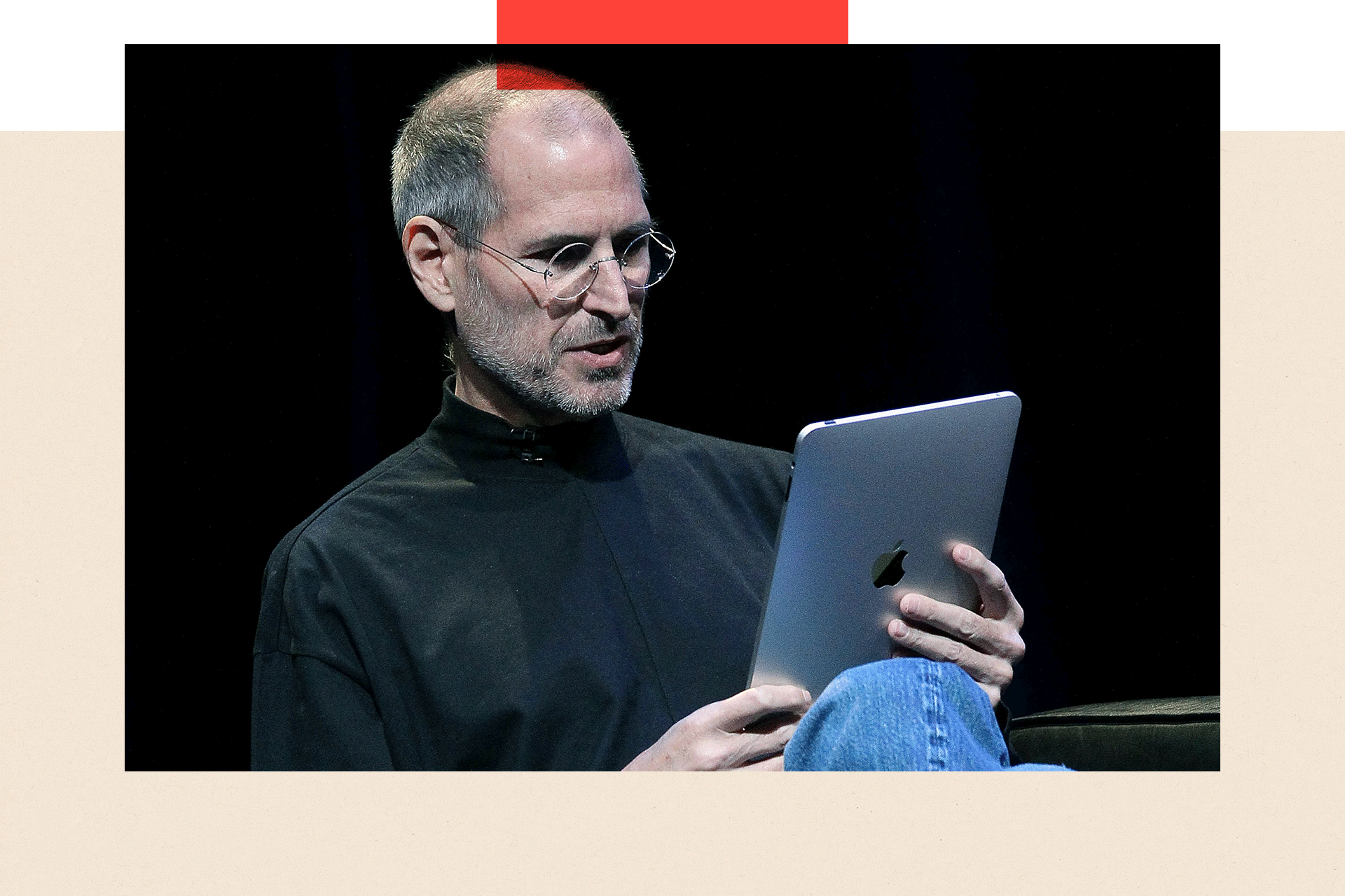 Steve Jobs with an iPad in hand