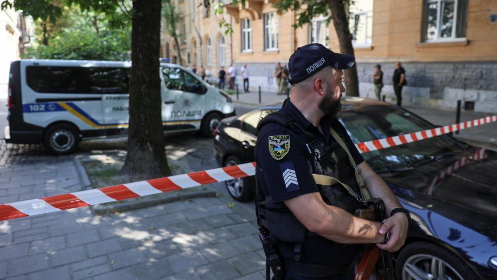 Ukrainian police guard at the site of the killing of Andriy Parubiy in Lviv