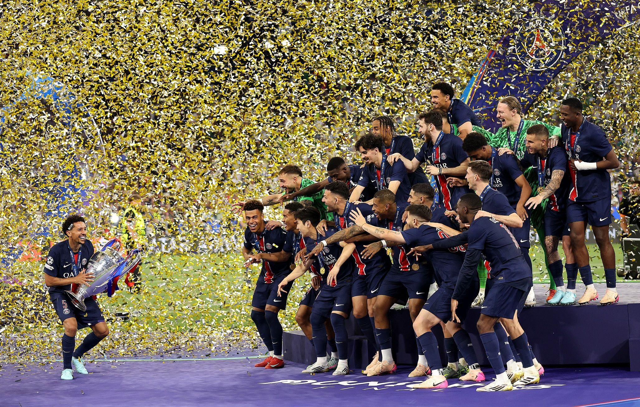 Marquinhos prepares to lift the trophy after Paris St-Germain's beat Inter Milan to win the Champions League for the first time