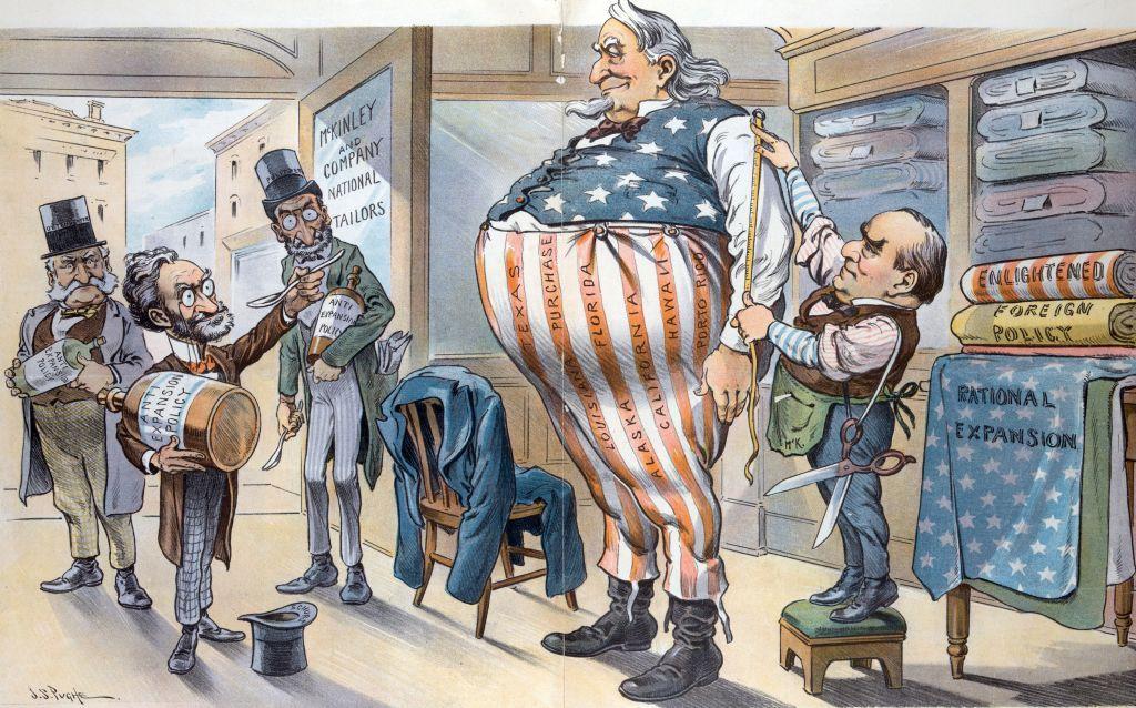 Novcem do novih granica: Kako se Amerika širila kupovinom teritorija 3 Karikatura objavljena u tadašnjoj štampi prikazuje krojača kako uzima mere visokom, krupnom čoveku odevenom u boje američke zastave. U prostoriju u tom trenutku ulaze još trojica muškaraca noseći velike tegle i kašike. Na jednoj od tegli stoji natpis „anti-ekspanzionistička politika“.