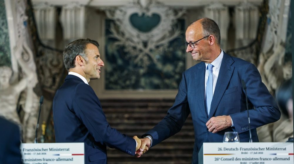 Emanuel Makron i Fridrih Merc